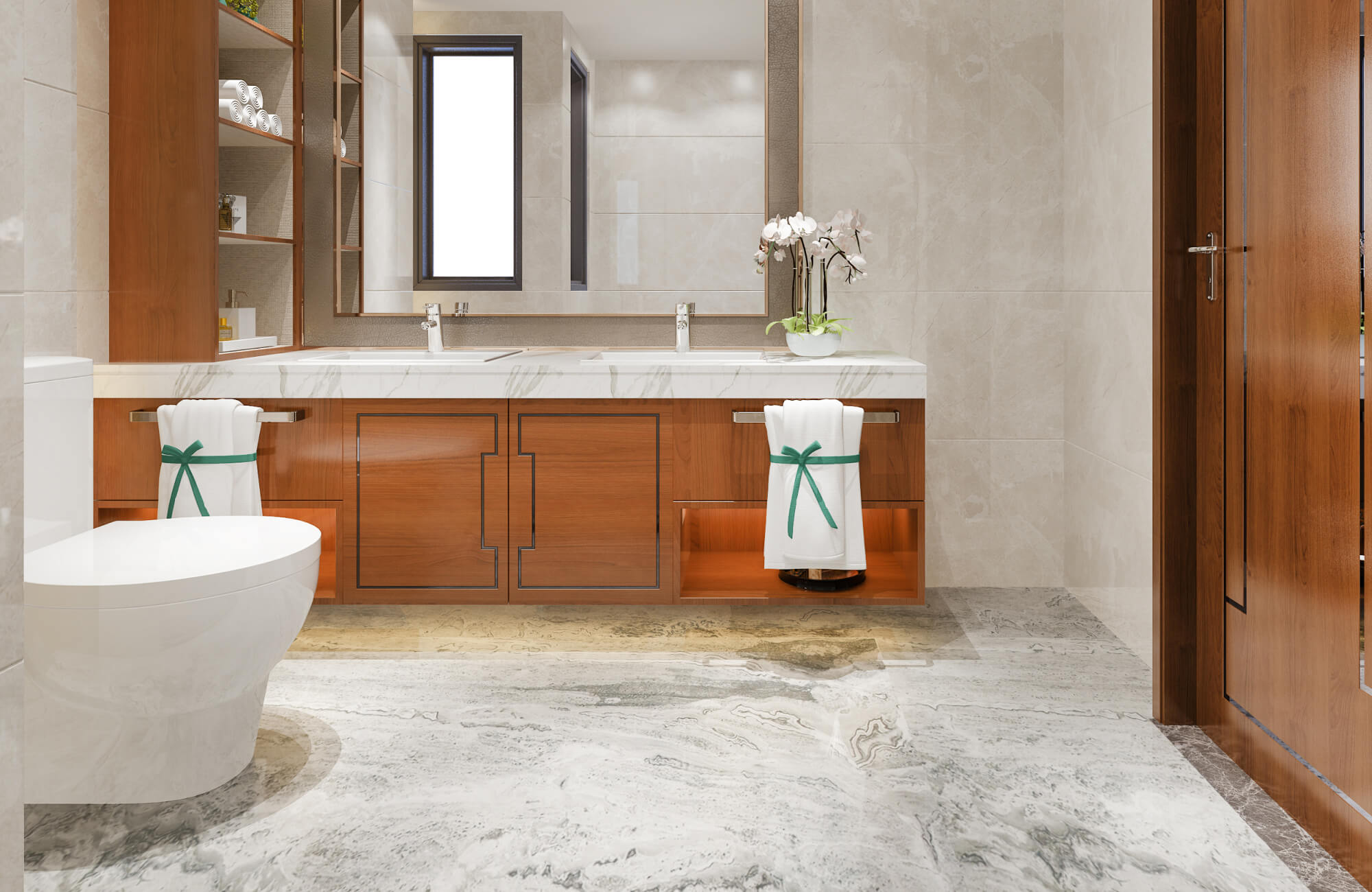 A luxurious bathroom features polished marble floors and countertops, warm wood cabinetry, and elegant orchid accents.