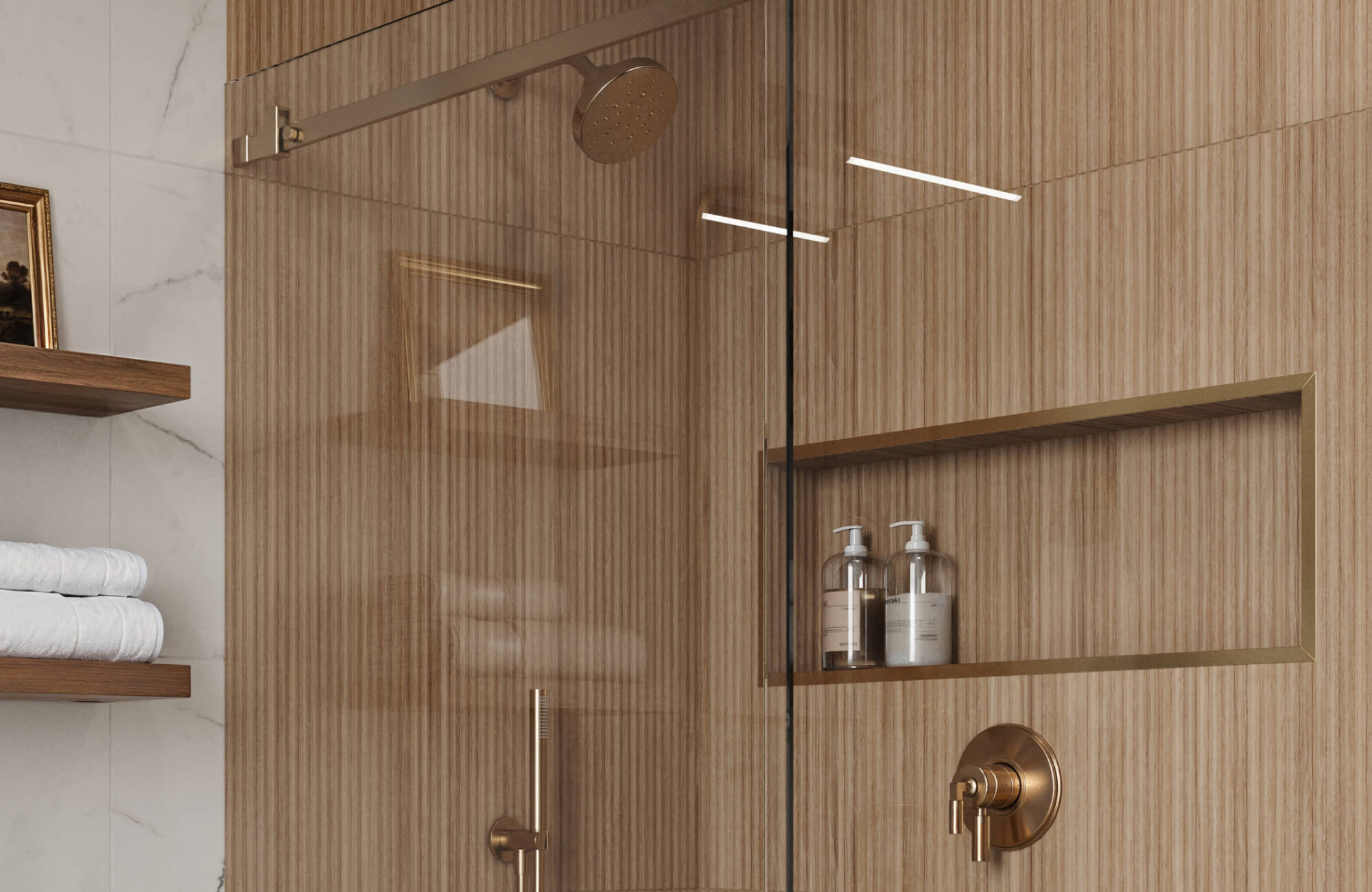 Sophisticated wood-look tiles in a bathroom shower exude warmth and elegance, complemented by brass fixtures and seamless shelving.