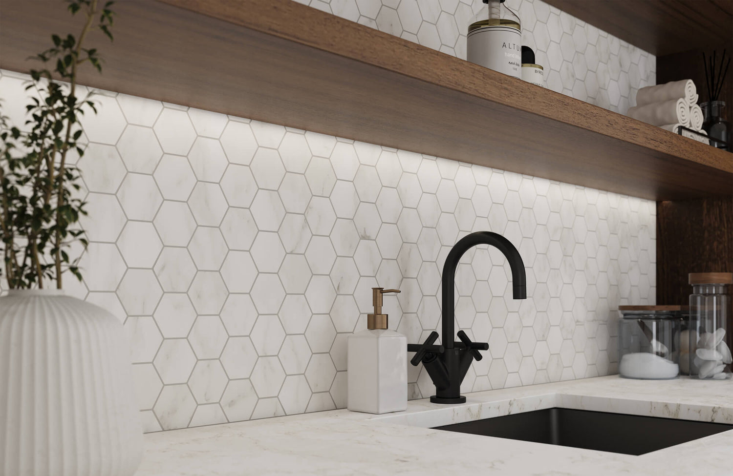 Hexagonal white marble-look tiles form a sleek backsplash, complemented by a matte black faucet and minimalist decor, creating a refined, modern kitchen aesthetic.