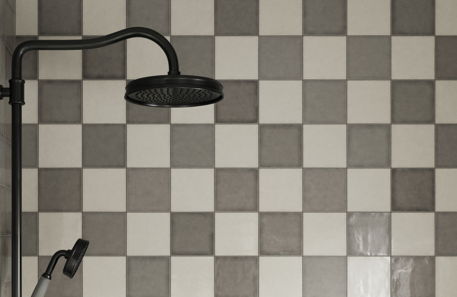 Matte finish checkerboard tiles in alternating shades of gray, creating a modern and sleek shower backdrop.