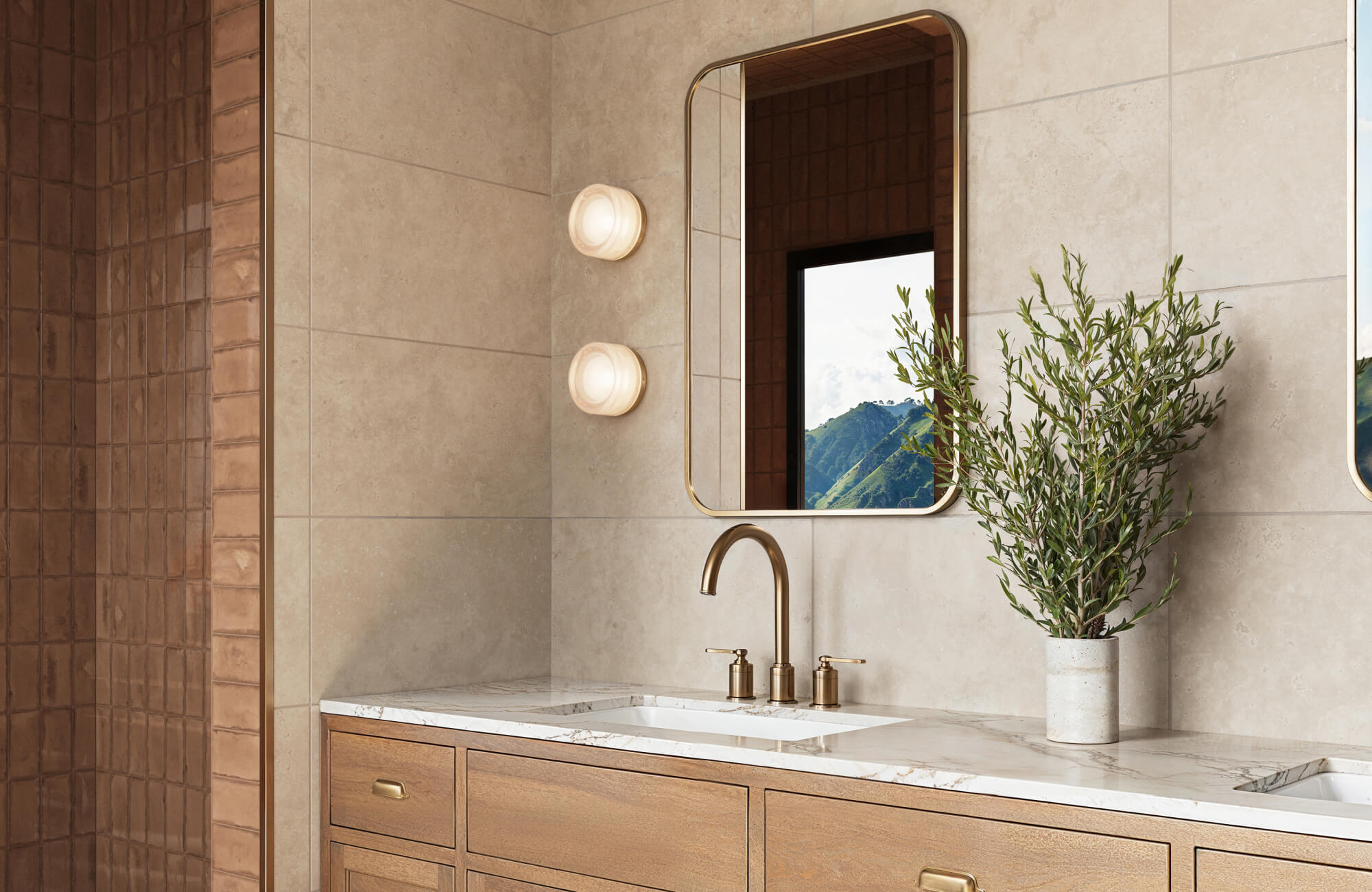 Polished bathroom with light beige marble-look wall tiles, a marble vanity top, and brass fixtures, exuding warmth and elegance.