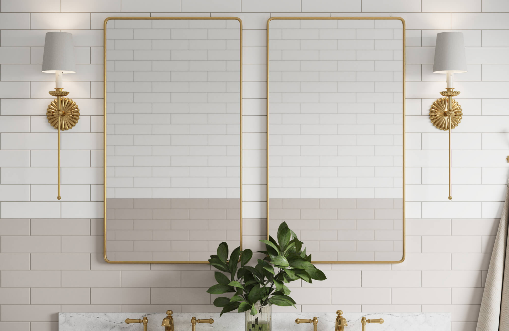 Elegant vanity wall with two gold-framed mirrors, white subway tiles, brass fixtures, and decorative sconces for a timeless appeal.