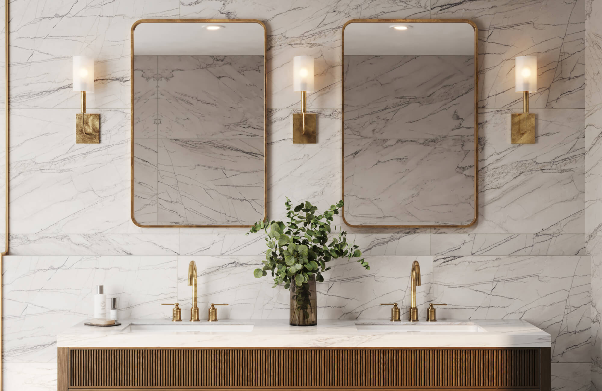 Luxurious bathroom featuring marble-look tiles with striking veining, gold fixtures, and dual sinks beneath elegant gold-framed mirrors, exuding sophistication.