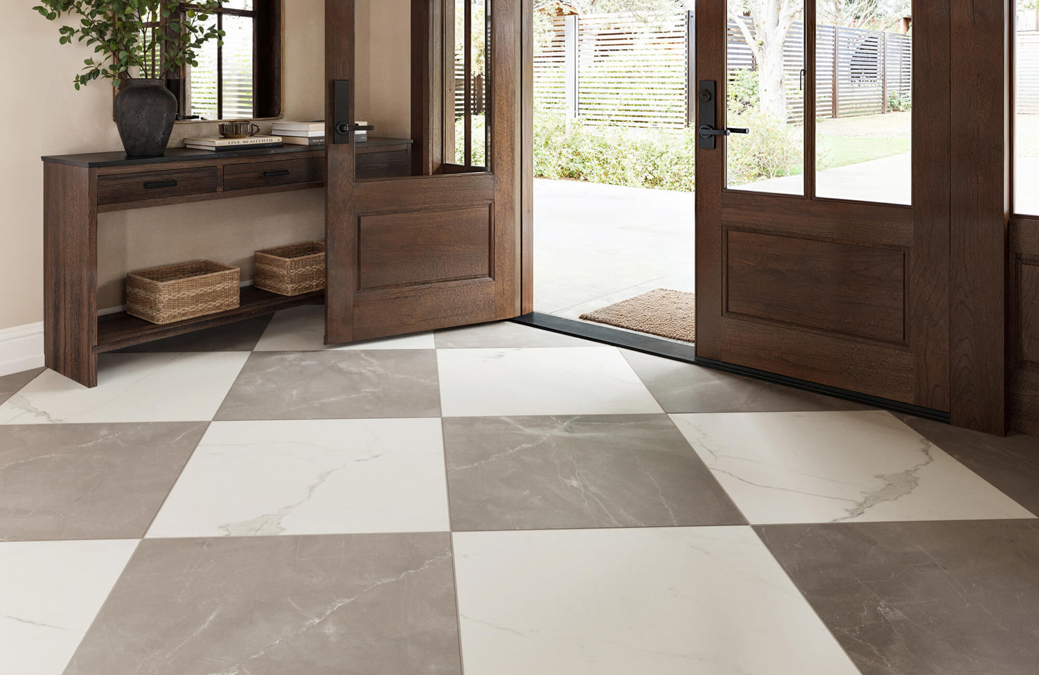 Welcoming entryway featuring large beige and white marble look checkerboard tiles, with wooden double doors and a rustic console table with wicker baskets