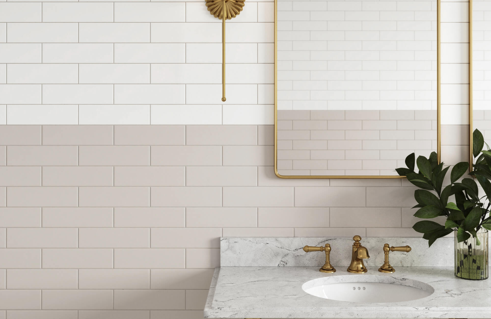 Elegant bathroom with a two-tone subway tile backsplash with white grout, marble countertop, and brass fixtures, creating a timeless and refined look.