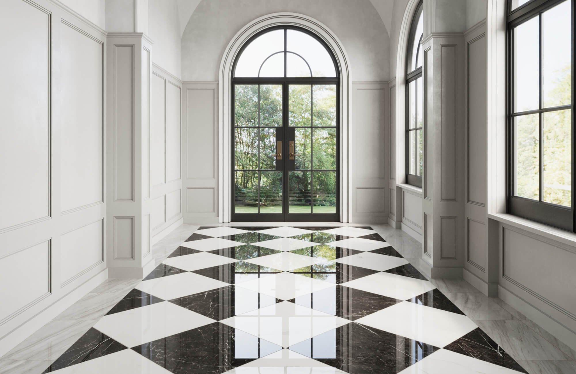 Elegant hallway featuring black and white checkerboard floor tiles, large arched windows, and a grand chandelier