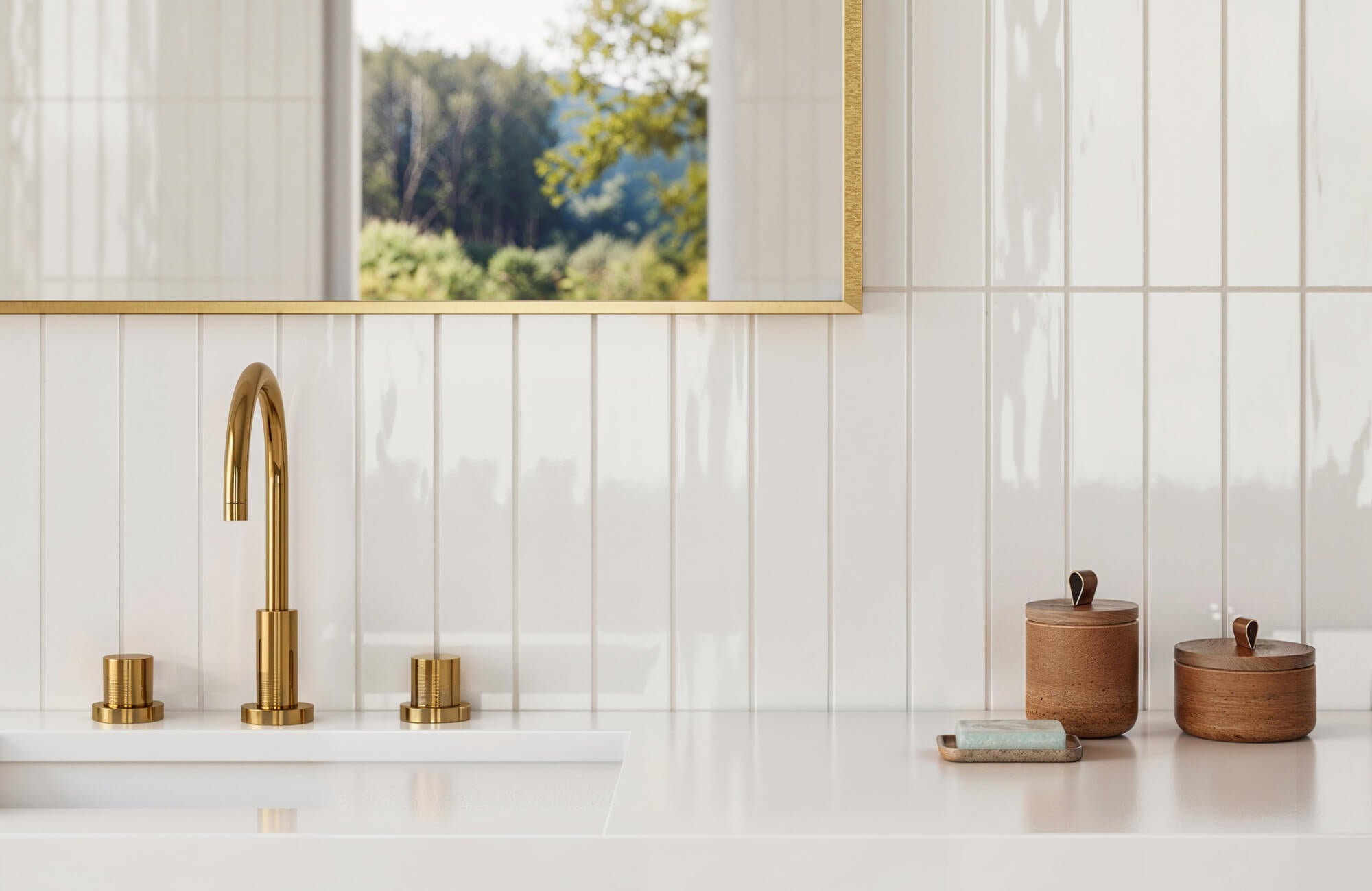 Elegant bathroom with glossy white vertical subway tiles, gold fixtures, and a large window reflecting greenery