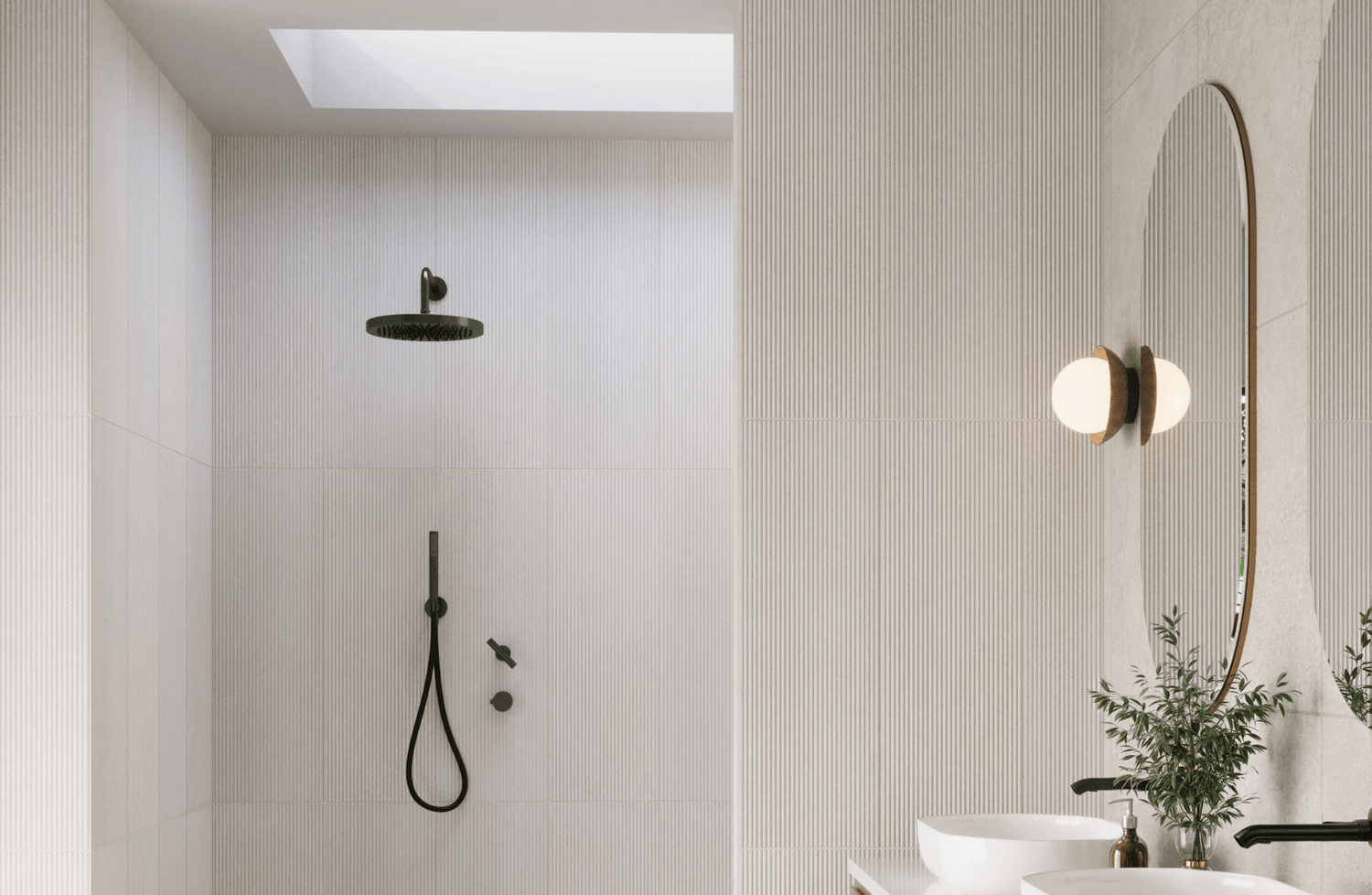 Minimalist bathroom with textured white tiles, a matte black rainfall showerhead, and sleek fixtures, complemented by a large round mirror and soft lighting.