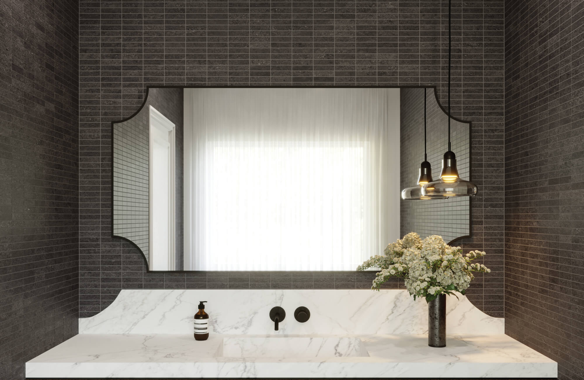 Sophisticated bathroom with dark porcelain mosaic tiles that add depth, while a large mirror enhances light and makes the space feel more expansive.