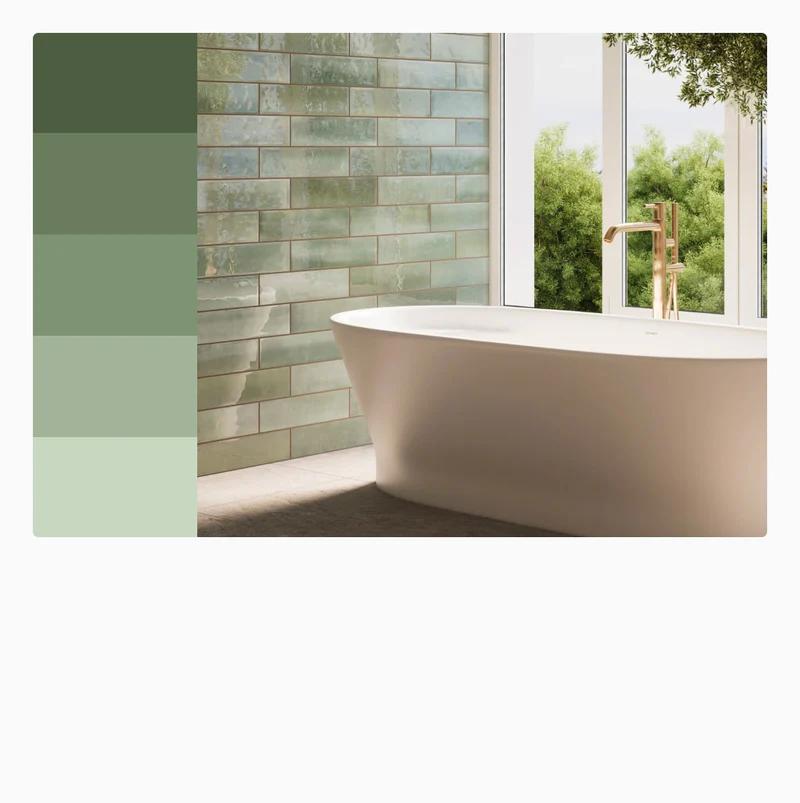 Serene green bathroom tiles bring a natural, refreshing vibe to the space, beautifully complemented by a freestanding tub and large windows