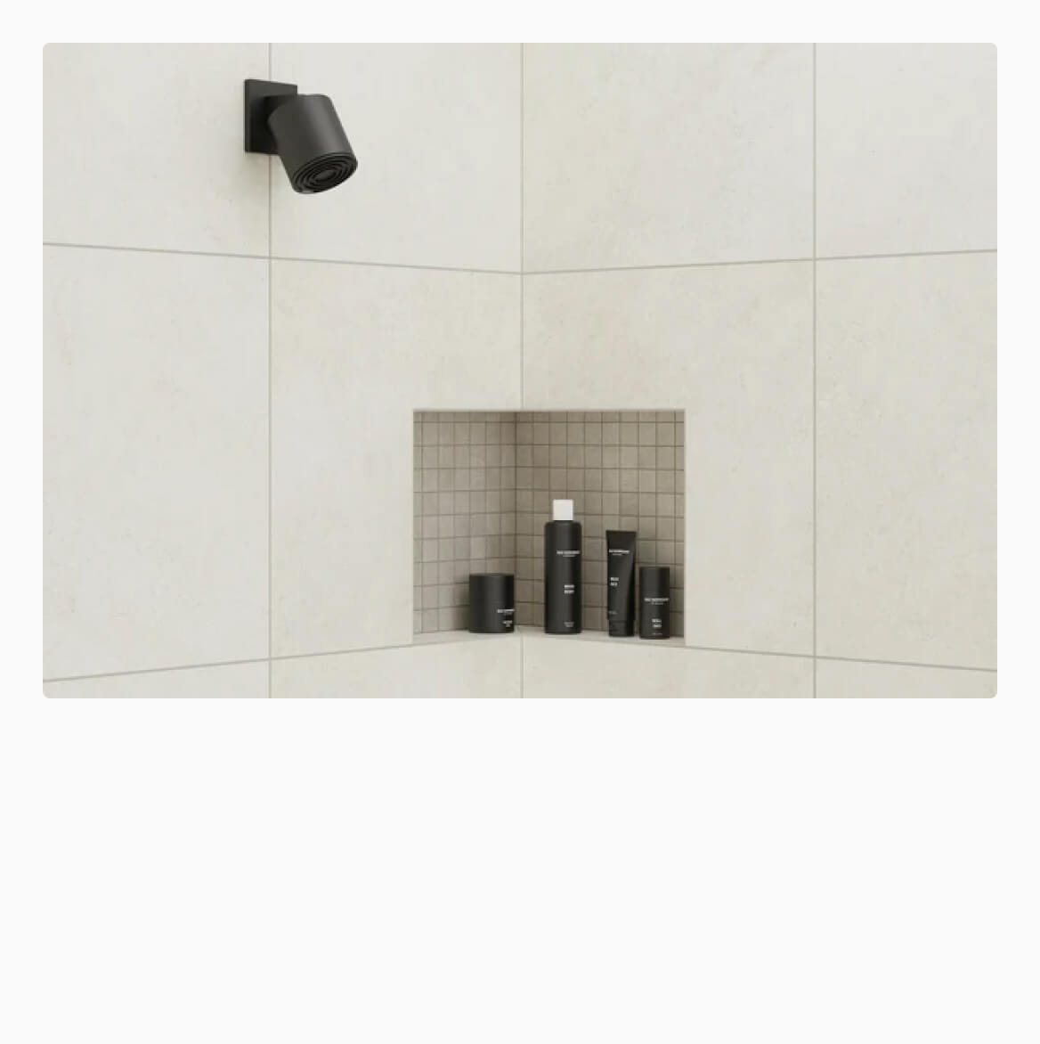 Modern shower niche with contrasting 24x24 tiles and stylish black fixtures