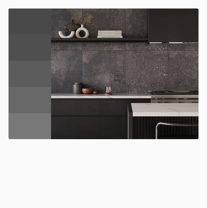 Dark gray kitchen tiles with a subtle speckled texture enhance the sleek and modern design of this contemporary kitchen