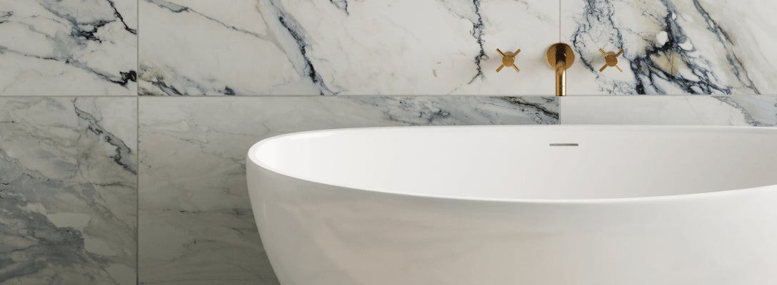 Close-up of a freestanding tub on 24x48 cream woven-pattern matte tiles, adding subtle texture and elegance to the bathroom floor.