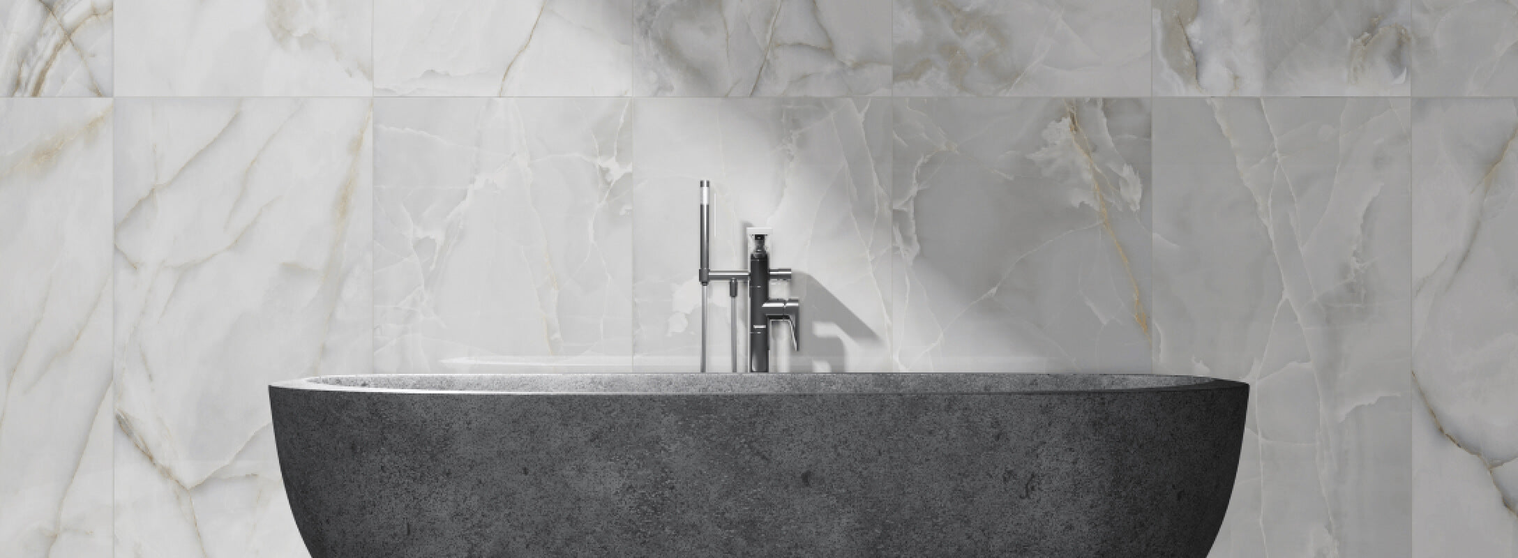 Marble-effect tiles grace a serene bathroom, complementing a modern stone basin