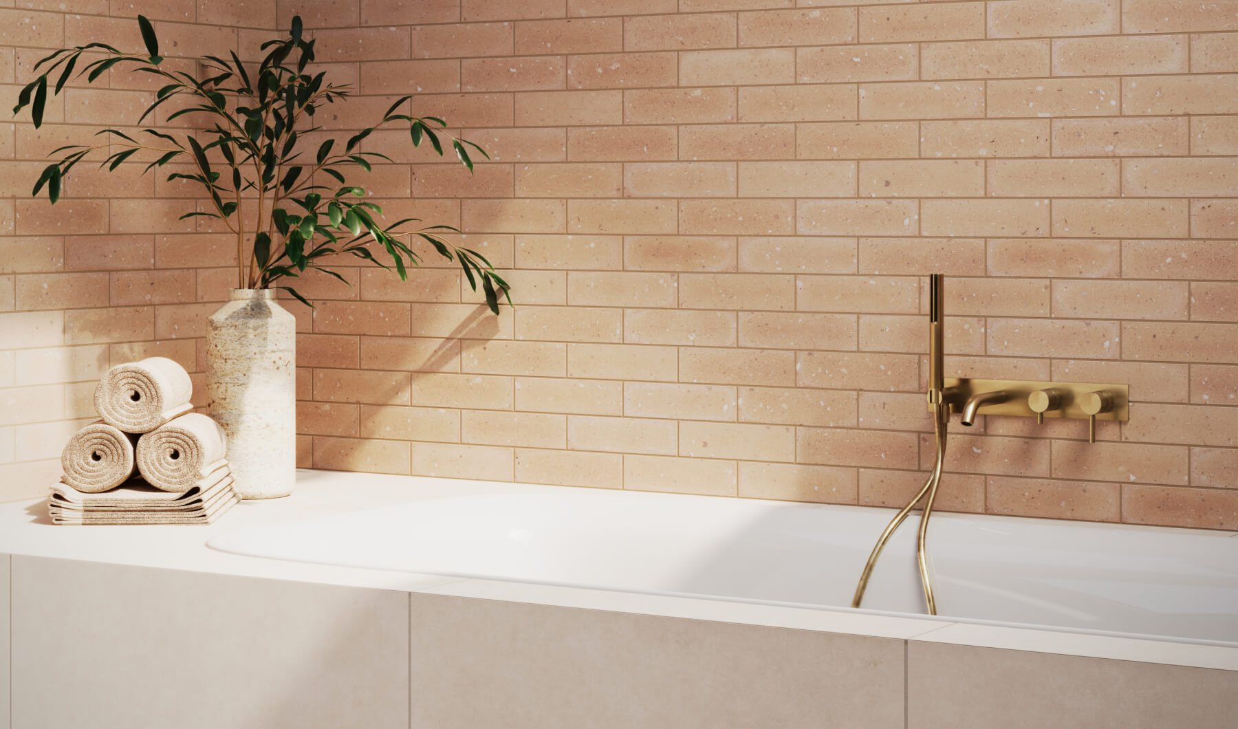Warm terracotta brick-look tiles create a cozy ambiance in a sunlit bathroom with gold fixtures