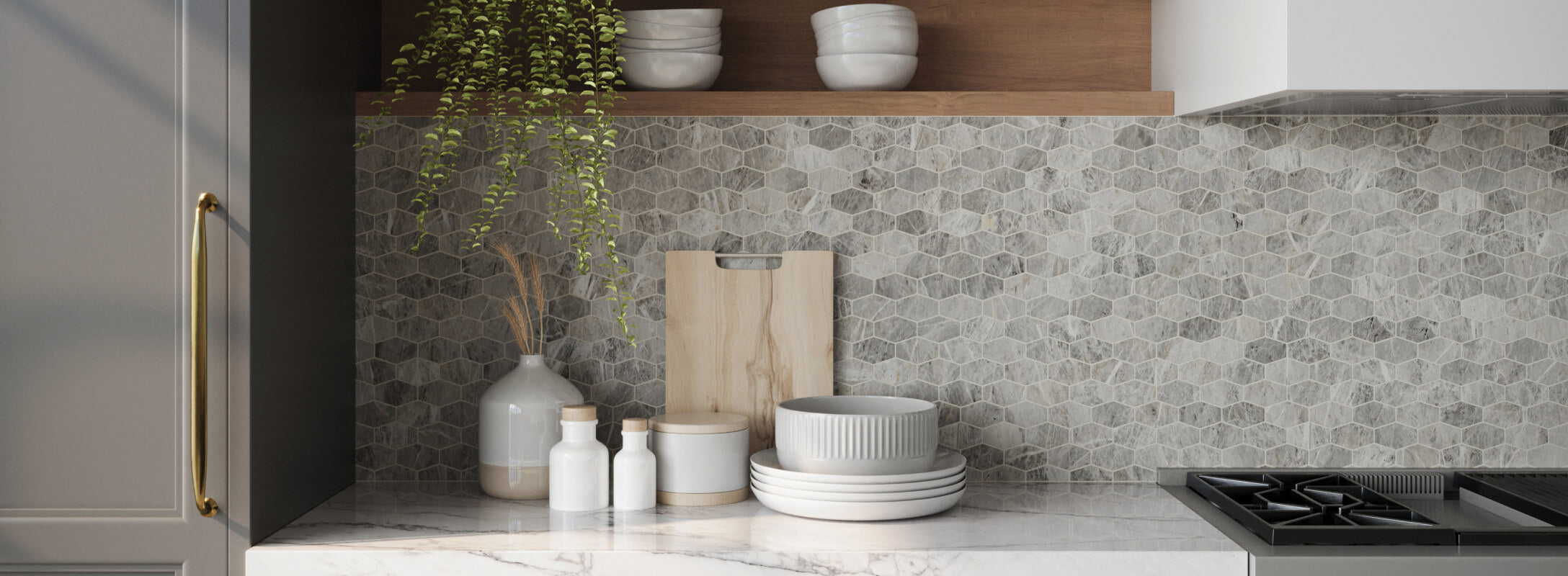 Modern kitchen with hexagonal grey mosaic backsplash tiles that look like marble, sleek marble countertops, and natural wooden accents, creating a calm and stylish space