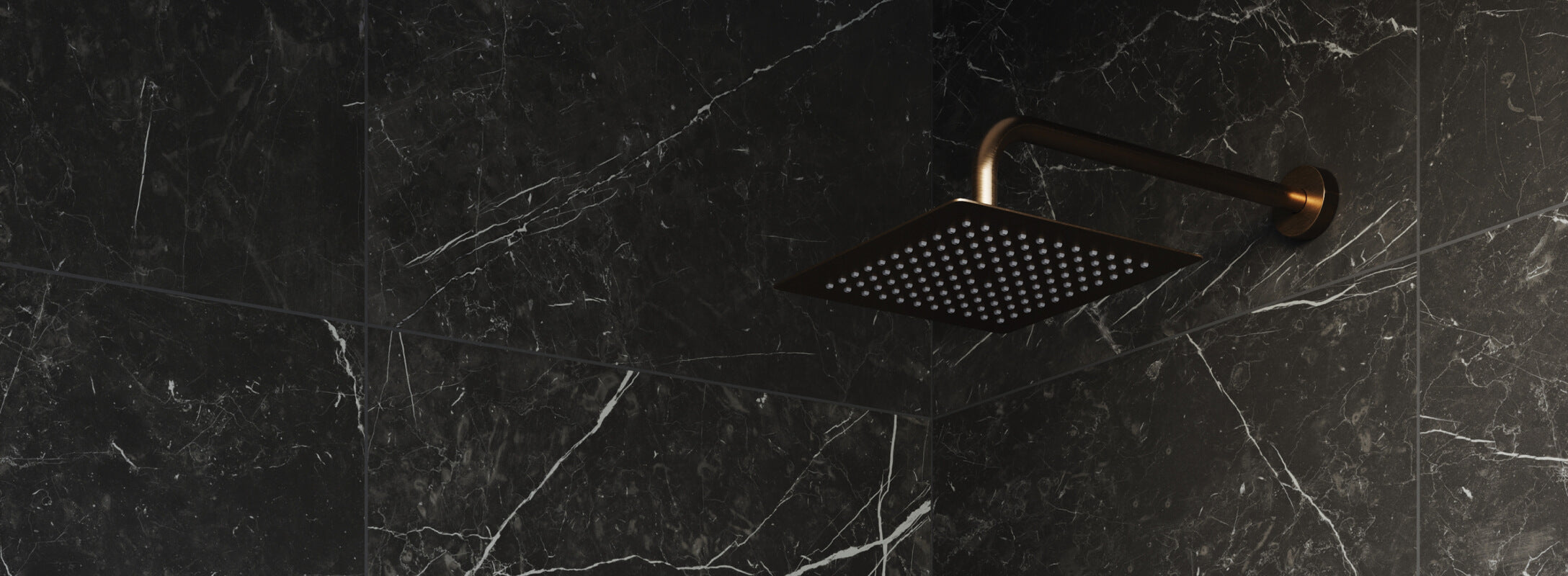 Luxurious shower featuring a sleek black marble wall with intricate white veining and a modern gold showerhead, embodying sophistication and elegance