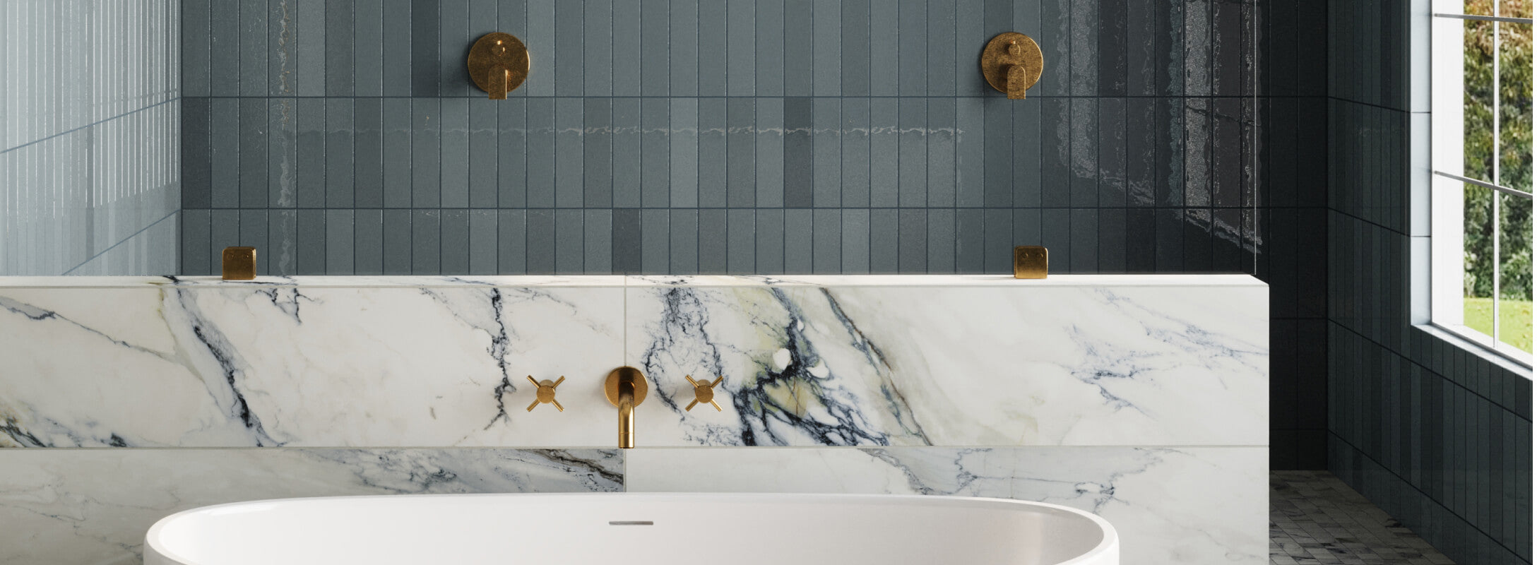 Elegant bathroom showcasing a mix of marble-inspired and blue tiles, with brass fittings adding a touch of luxury