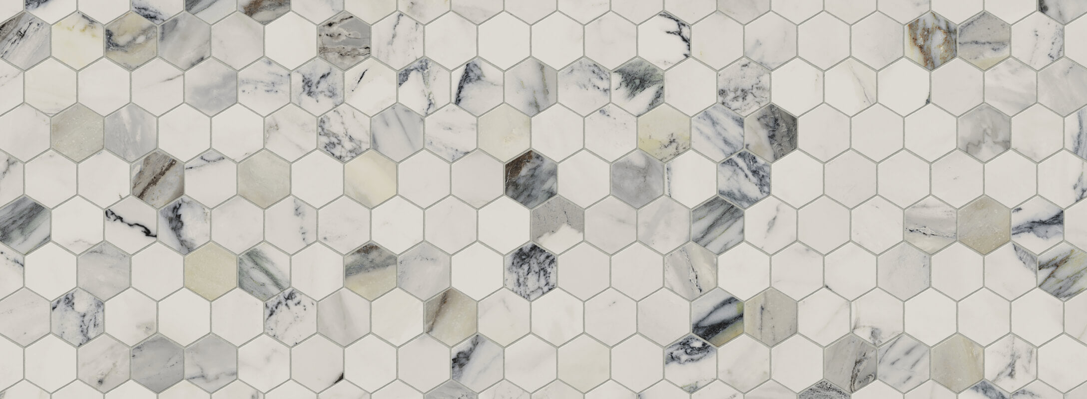 Stylish hexagonal marble tiles create a captivating mosaic, blending natural tones for an elegant surface finish