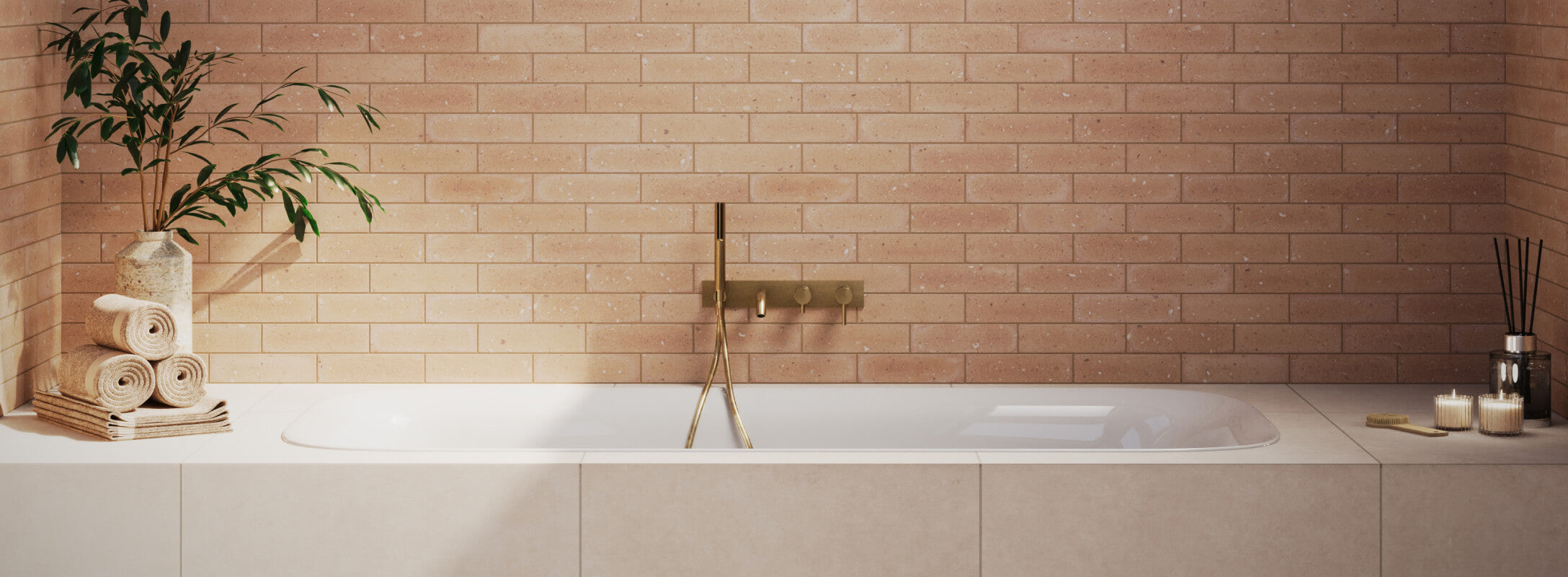 Warm orange-toned tiles in a sleek subway layout, adding a soft, serene ambiance to this spa-like bathroom setting