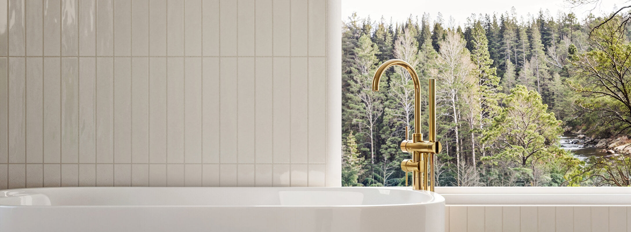 Vertical white tiles complementing a luxurious bathtub with a golden faucet, set against a serene forest view