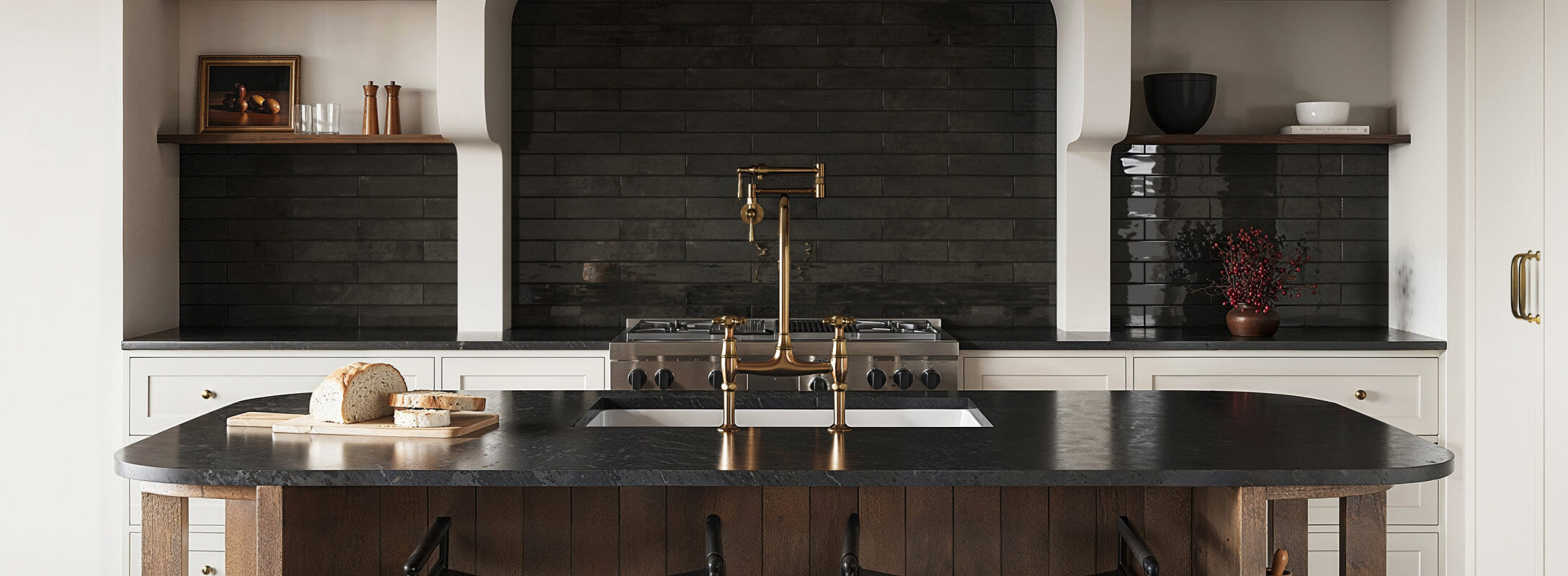 Elegant kitchen featuring black subway tiles as a backsplash, complemented by a dark countertop and brass fixtures, creating a sophisticated and modern ambiance