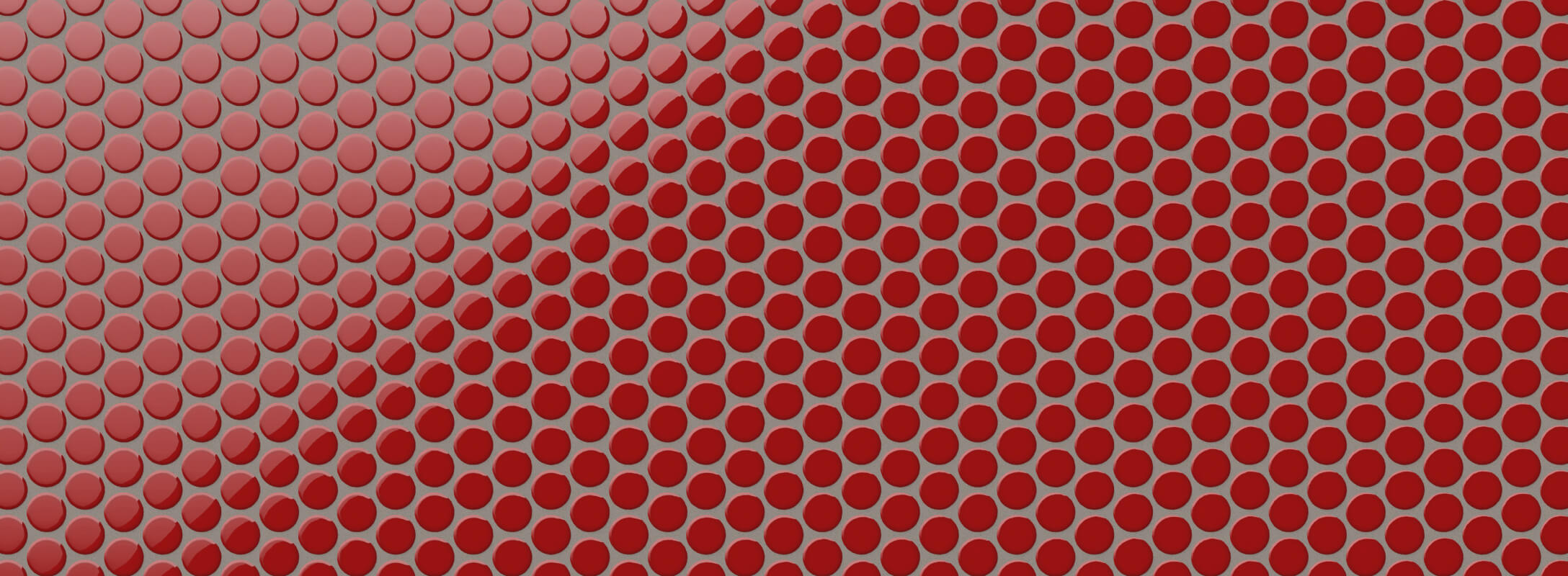 Glossy red penny round mosaic tiles create a bold and vibrant texture, ideal for striking accent walls or statement designs.