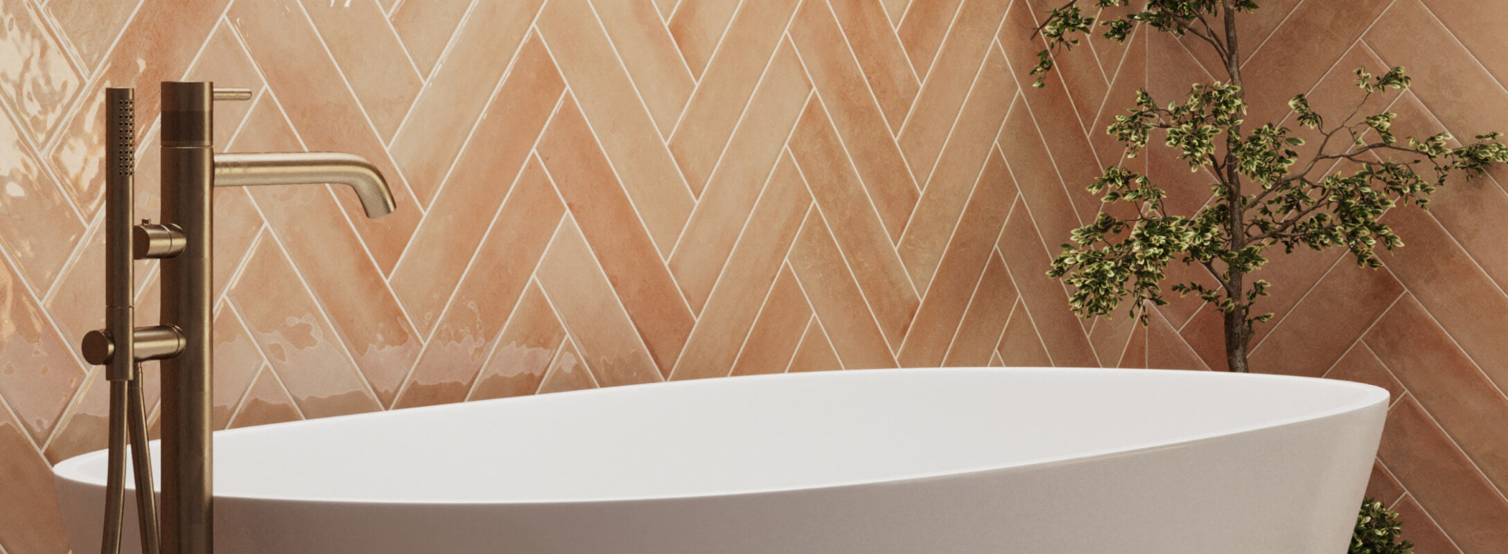 Luxurious bathroom with herringbone-patterned orange subway tiles, featuring a modern freestanding tub and brass fixtures