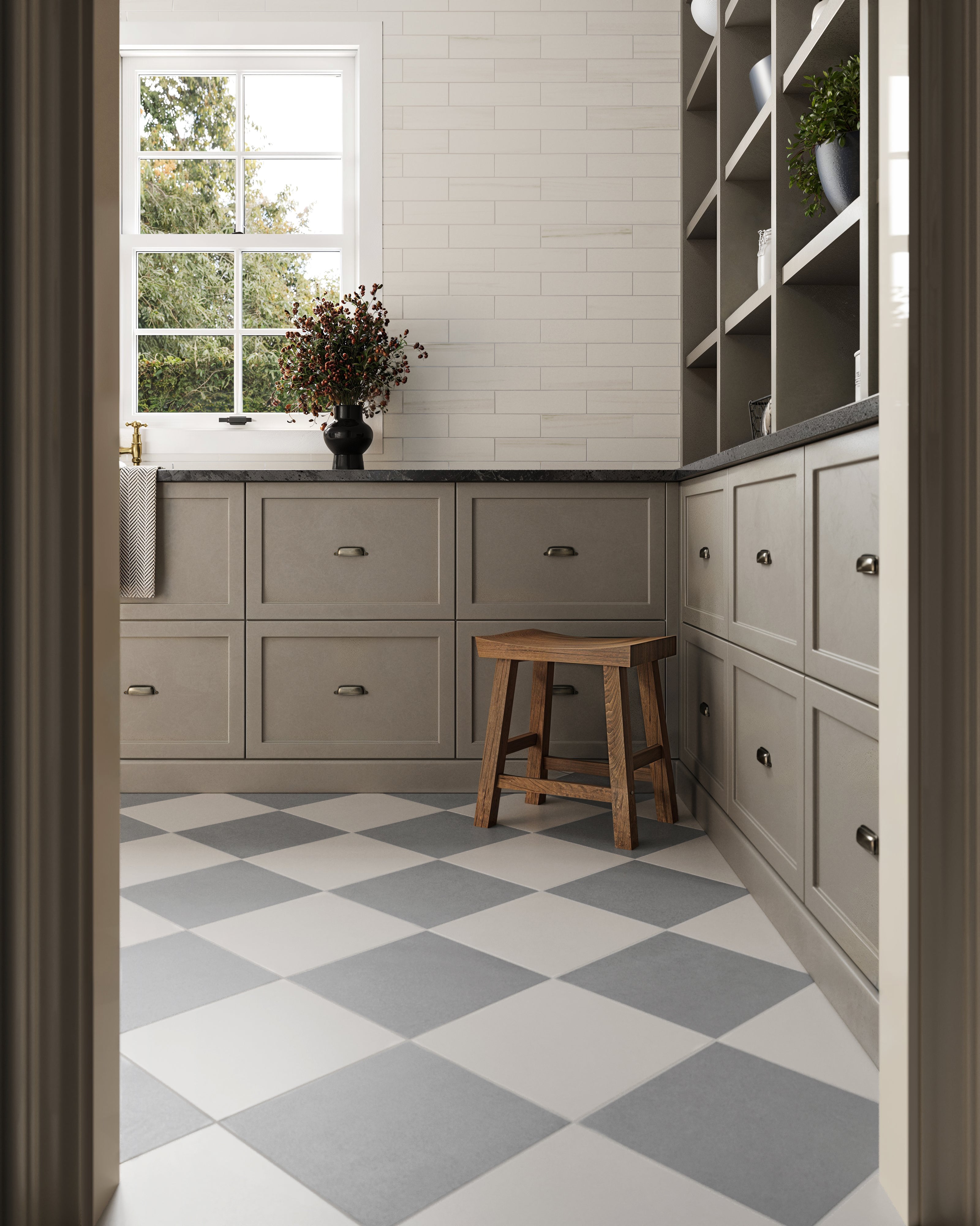 Rustic-inspired kitchen design featuring beige cabinets, wooden stool, and a checkerboard-patterned floor in white and grey tiles.