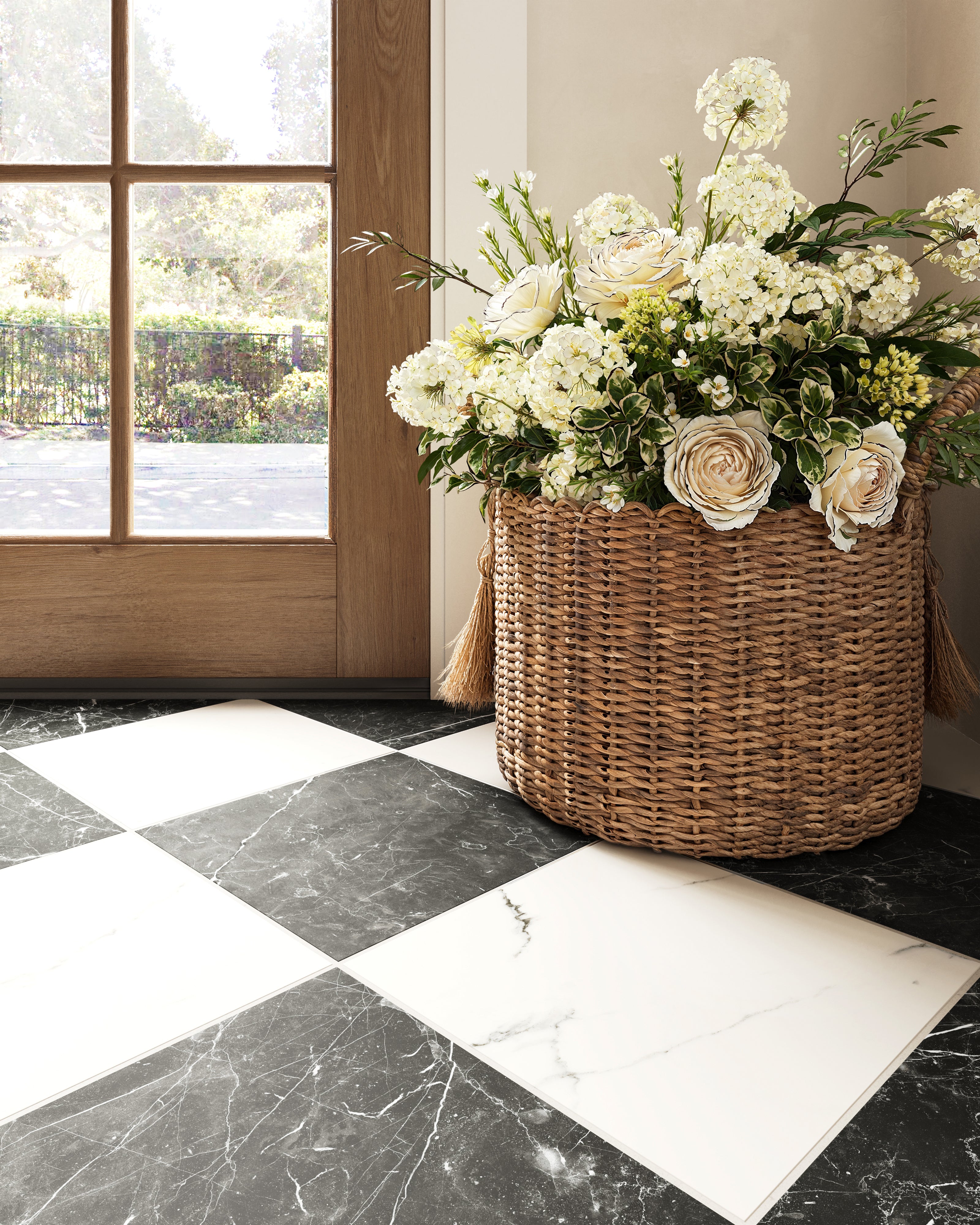 Bold Leona Calacatta and Nero Marquina Checkerboard 12x12 Matte tiles anchor the entryway with classic charm and modern contrast.